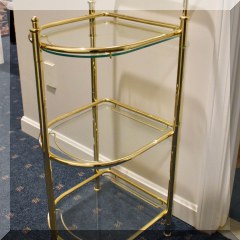 F74. Brass and glass shelf. 33”h x 13”w x 16”d - $48 